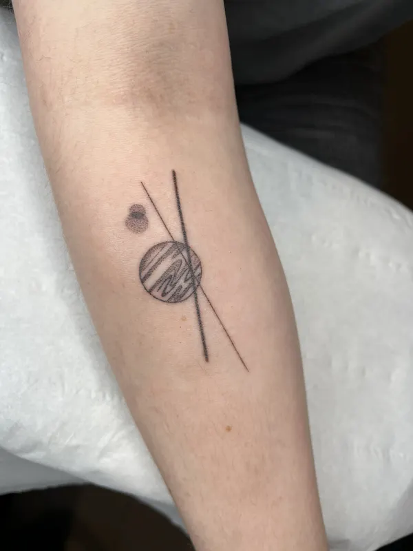 Fine line planet and axis hand-poked on the forearm