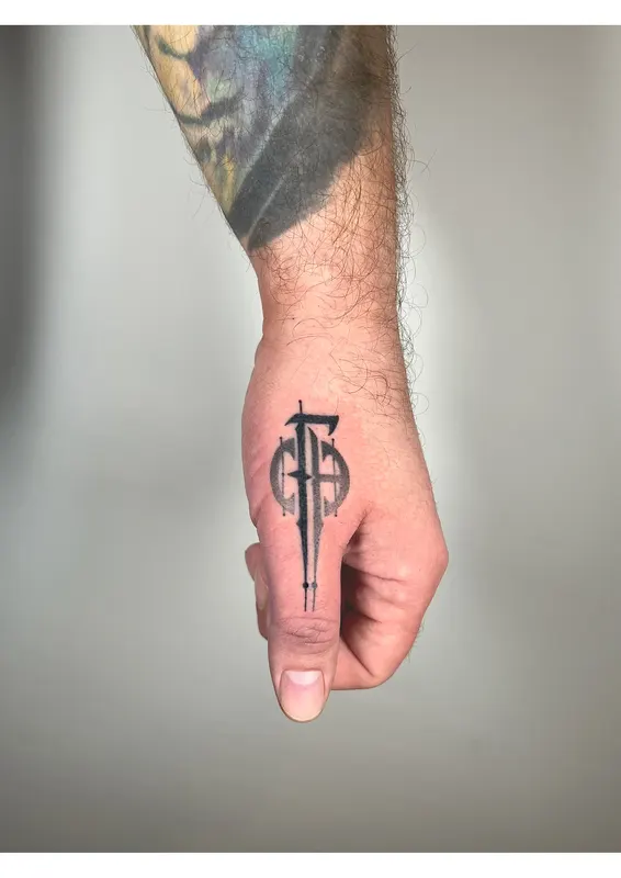 Hand-poked symbol on the back of the hand